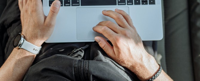 Free A Person Working on His Laptop Stock Photo